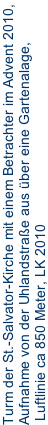 Turm der St.-Salvator-Kirche mit einem Betrachter im Advent 2010,  Aufnahme von der Uhlandstraße aus über eine Gartenalage,  Luftlinie ca 850 Meter, LK 2010